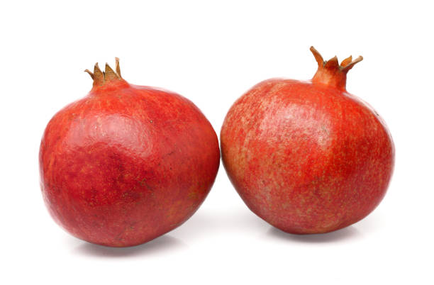 istock Pomegrandes on white background 1567393724