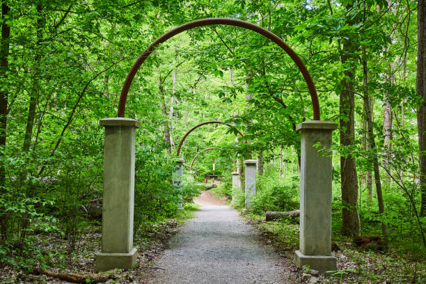 Image of Gray stone, rock arch bases with rusty iron metal arches
