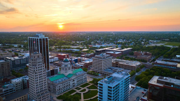 istock Horizontal aerial panorama golden sunrise over downtown Fort Wayne with focus on courthouse 1567400511