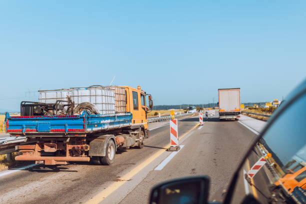 istock Cars and trucks on highway 1567400539
