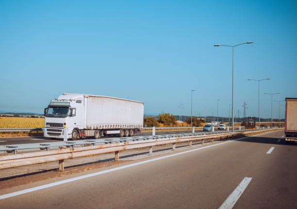 istock Cars and trucks on highway 1567400798