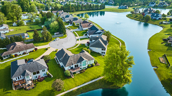 Aerial view of residential homes in Grand Haven, a small city in Ottawa County, Michigan, on a clear day in Fall.