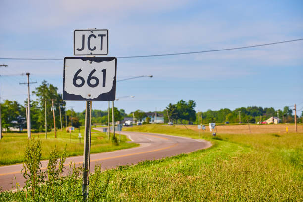 istock JCT 661 sign next to highway in summer with blue sky and thin clouds 1567402829