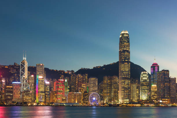 Victoria Harbor in Hong Kong city at dusk stock photo