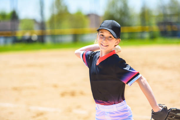 istock Young girl play baseball on summer day 1567413664
