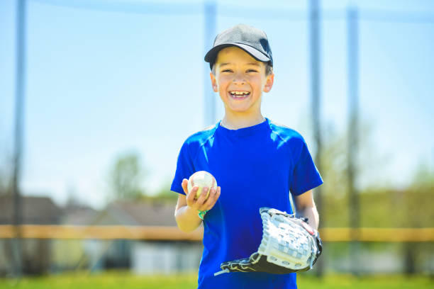 istock Young boy play baseball on summer day 1567416332