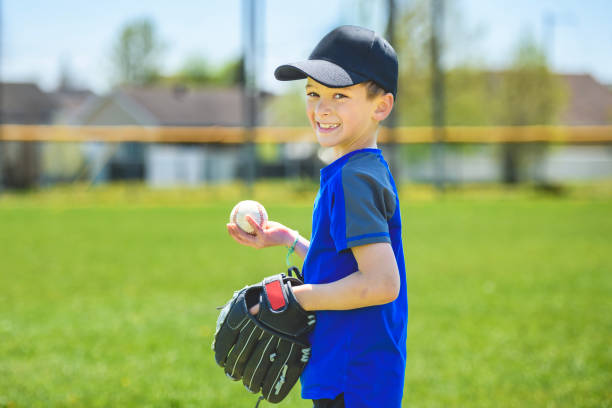 istock Young boy play baseball on summer day 1567416338