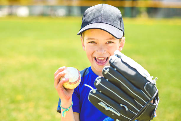 istock Young boy play baseball on summer day 1567417388