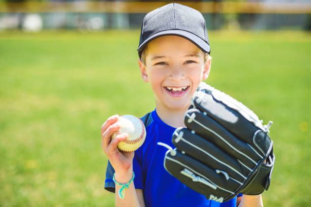 istock Young boy play baseball on summer day 1567417415