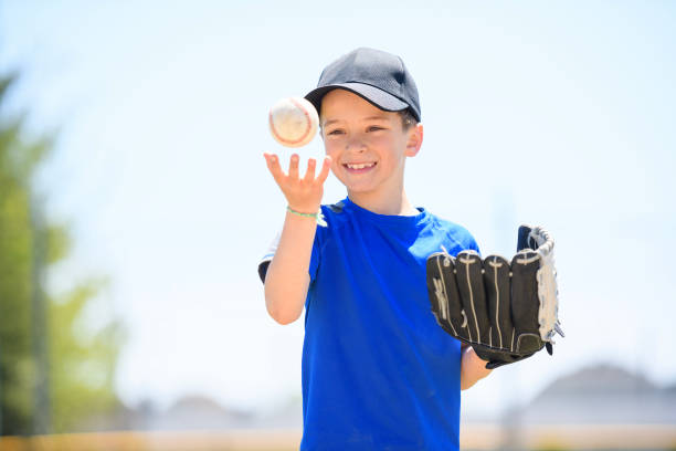 istock Young boy play baseball on summer day 1567417935