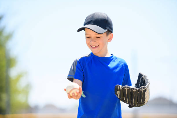istock Young boy play baseball on summer day 1567417938