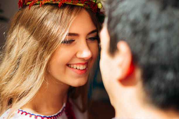 istock Happy bride with a charming smile looks at her husband 1567420856