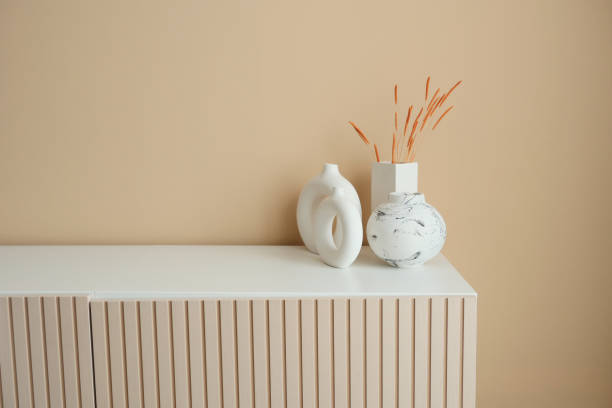 istock home interior decoration against light orange color wall . 1567423605