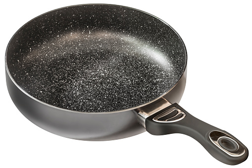 New, modern, heavy duty, non-stick black colored Wok frying pan, with non-slip handle and ceramic coated white spotted inner surface, isolated on white background, side view.