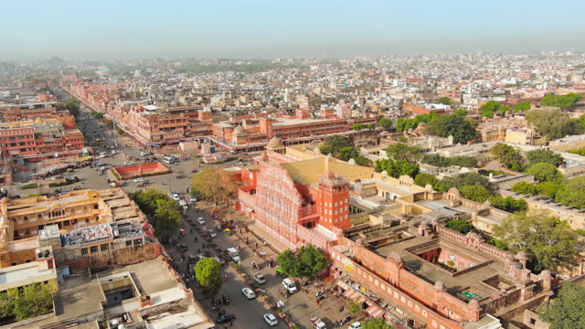 Jaipur, India: Aerial view of capital and largest city of Rajasthan, famous palace The Hawa Mahal, built from red and pink sandstone  - landscape panorama of South Asia from above