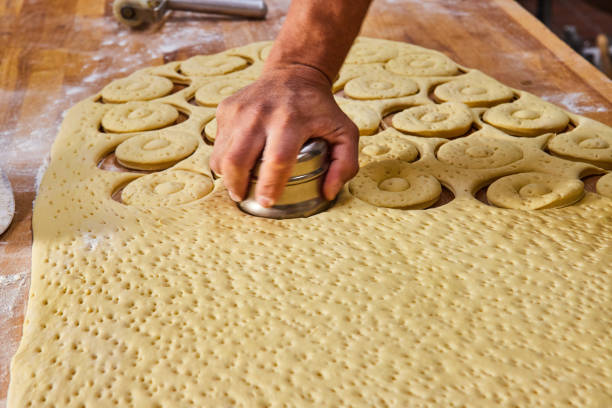 istock Old fashioned donuts, fresh cut dough, by hand, handmade artistic baking 1567441761