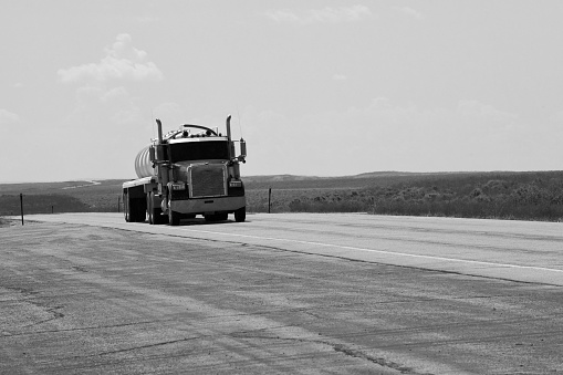 Rock Springs, Wyoming USA- July 19, 2023  Tanker Trucks carrying some unknown fluid have an open road on this remote stretch of highway in Wyoming. This shot was taken on a road trip between Rock Springs and Pinedale Wyoming.