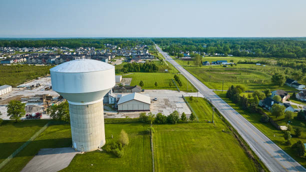 istock Rural area with housing and nondescript white water tower aerial 1567457508