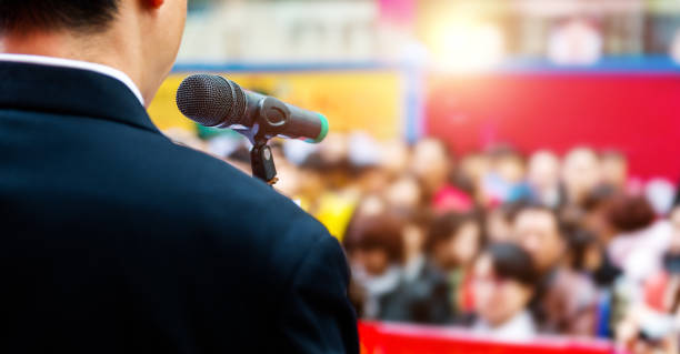 Businessman making a speech in front of crowds