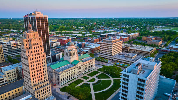 istock Sunrise off building skyscraper windows courthouse and train downtown Fort Wayne aerial architecture 1567474221