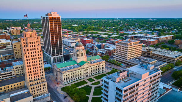 istock Sunrise off building skyscraper windows courthouse and train downtown Fort Wayne aerial cityscape 1567474224