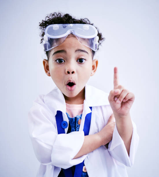 istock Child, hand and idea or solution for science in studio with mouth open, glasses and thought. Face of a African kid student shocked or wow for scientist, education or biology experiment for innovation 1567476654