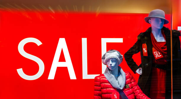 Window display with text SALE and fashion