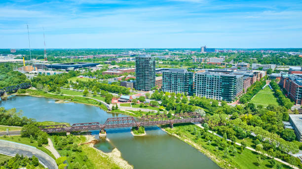 istock Train bridge leading into Columbus Ohio over Scioto River aerial 1567479425