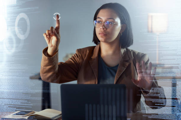 istock Woman, night and touch hologram with data, chart or information on dashboard, overlay or focus in office. Holographic ux, point and it expert by laptop, analytics or cloud computing in dark workplace 1567484925