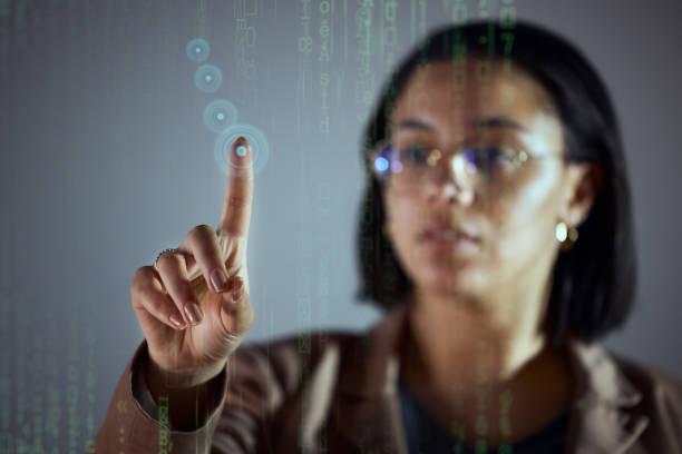 istock Woman, night and office with touch hologram display for big data, chart or information technology on dashboard. Holographic ux, point and it expert with analytics, cloud computing and dark workplace 1567484939