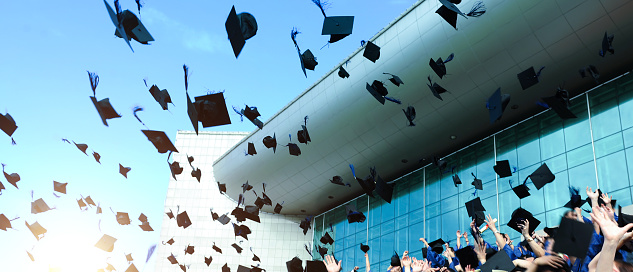 College and high school Graduation. Student cap, mortarboard hat black with gold tassel, blur background. 3d render