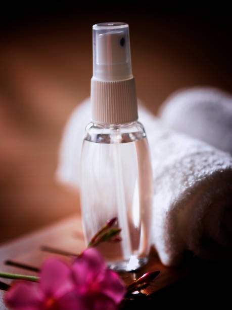 istock roll up towel  flower and massage oil 1567491218