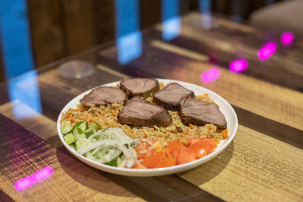 istock Food in white plate on table. Delicious dish. Hot dinner. 1567491637