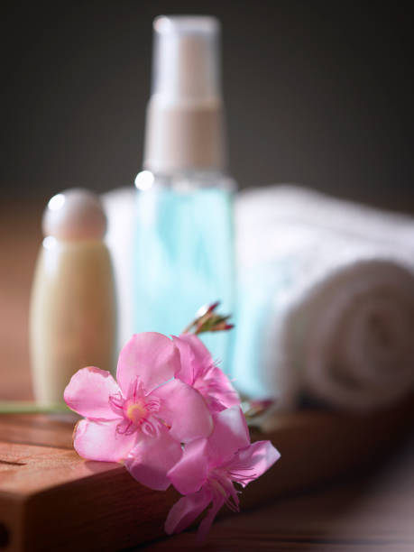 istock roll up towel  flower and massage oil 1567492350
