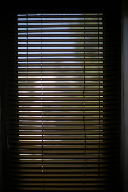 istock Blinds on window. Window in house. Gleam. 1567493091