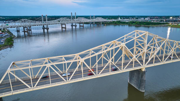 istock White gold truss bridge aerial at blue sunset over Ohio River 1567496121