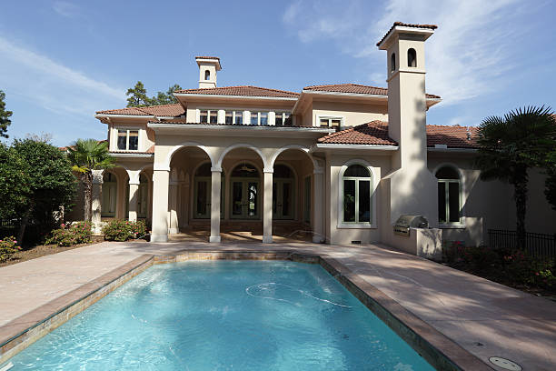 istock Exterior of a luxury home under sunny blue sky 156750656