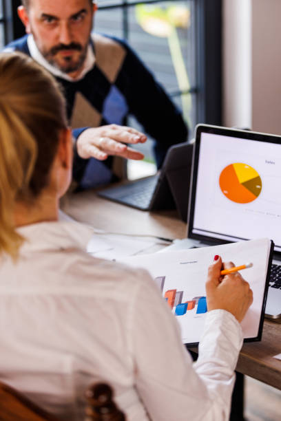 istock Businesswoman reviewing a clipboard with project result documents 1567508267