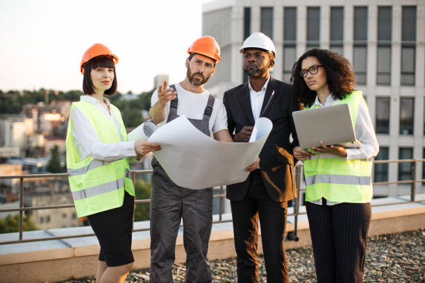 istock Industrial employees working on remodeling business center 1567509368