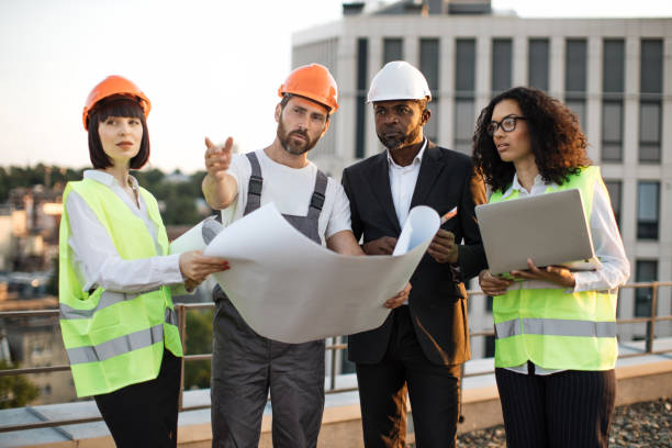 istock Industrial employees working on remodeling business center 1567509390