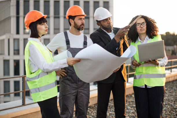 istock Industrial employees working on remodeling business center 1567509394