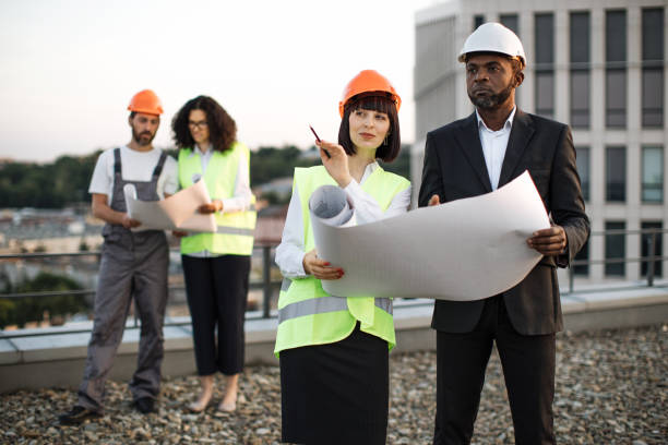 istock Multiracial specialists discussing real estate building 1567509935