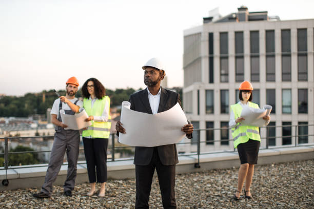 istock Diverse architects meeting in open air for plan discussion 1567509963