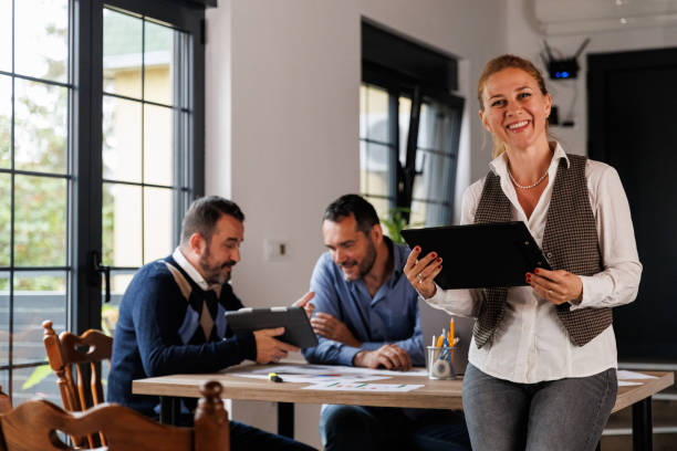 istock Charming mid adult businesswoman analyzing data on a clipboard 1567516164
