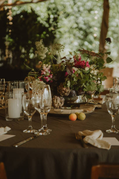 istock wedding decoration, setting table with pants and flowers 1567548169
