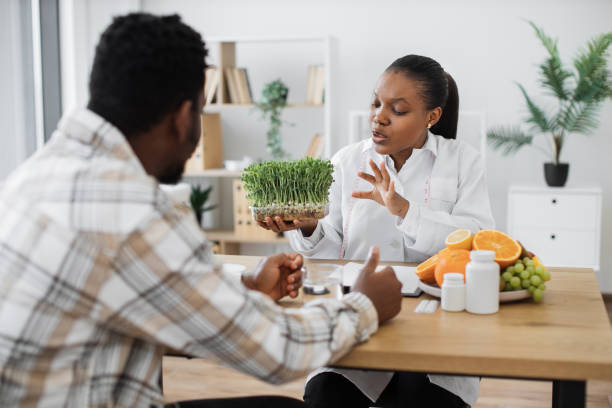 istock Nutritionist showing microgreens to client in clinic 1567549260