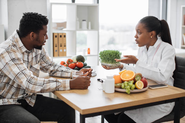 istock Expert advising man about microgreens in healthy diet 1567549274