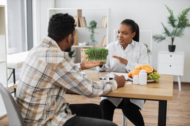 istock Expert advising man about microgreens in healthy diet 1567549310