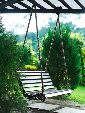 wooden swing at the garden