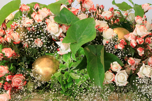 Beautiful rose flower bouquet with golden balls